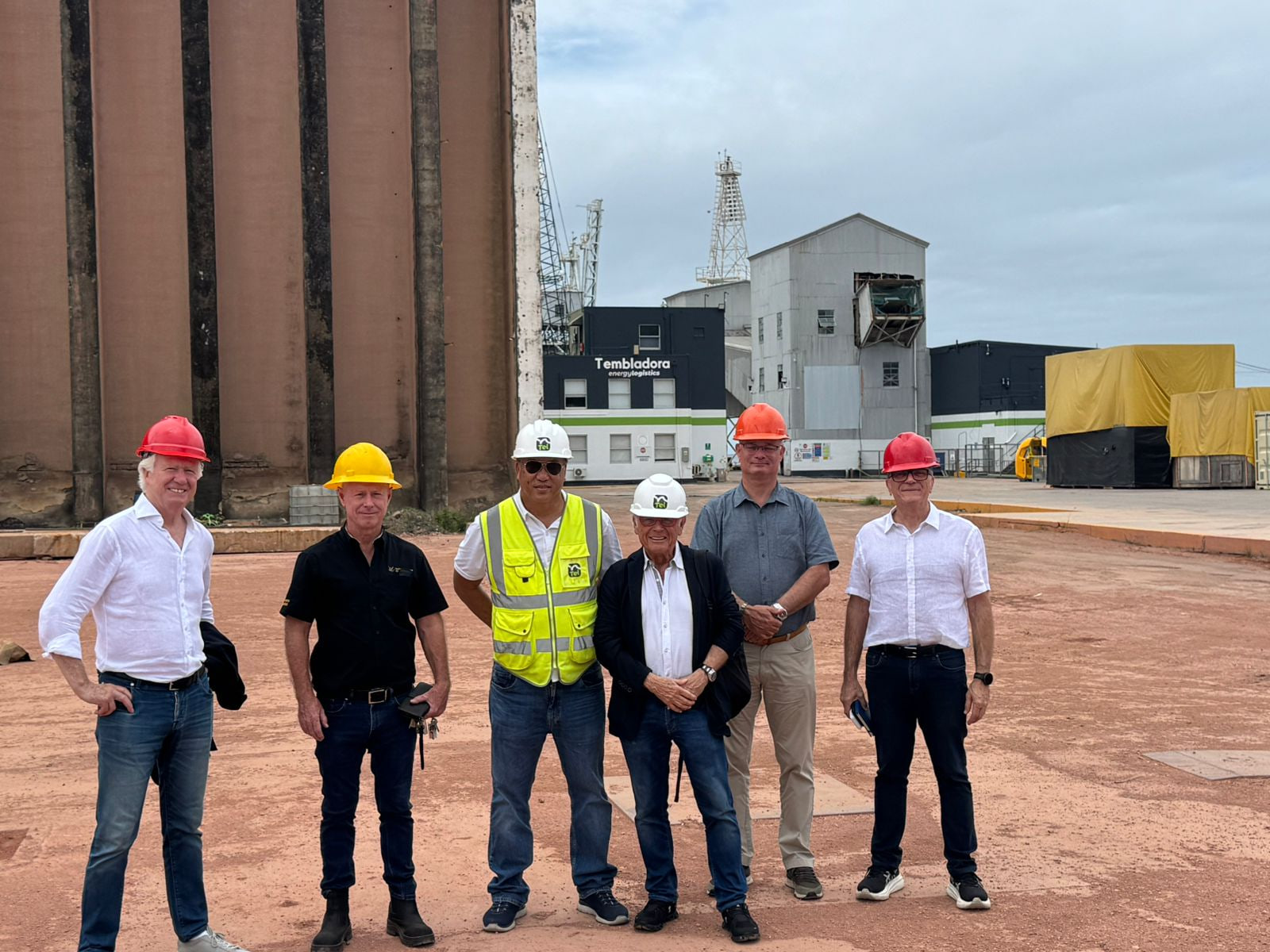 Representatives of Universal Africa Lines, Taylor Engineering Agencies, and Tembladora Energy Logistics standing together at a meeting